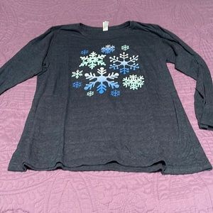 Long sleeve tee with snowflakes.  Shirt is Navy Heather in color.